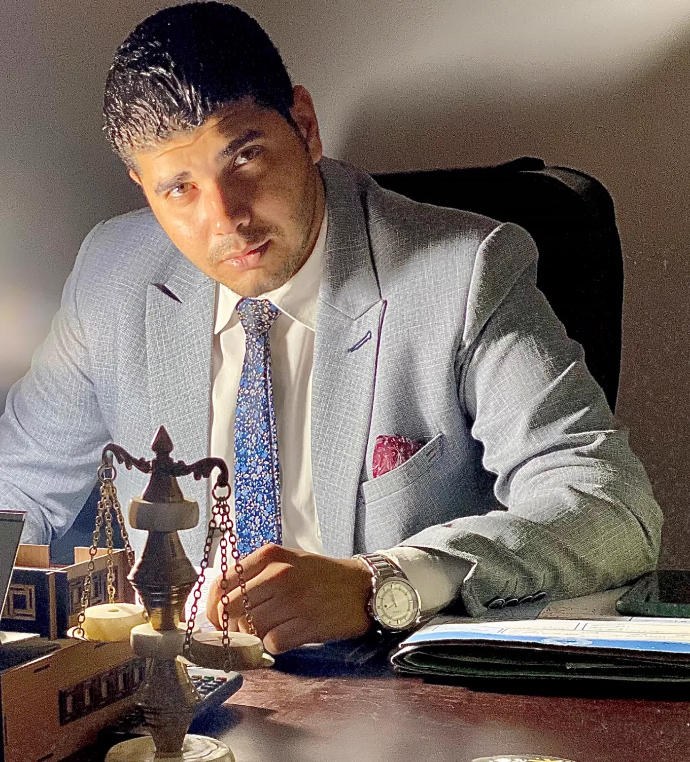 Case file review beside the scales of justice in Cairo